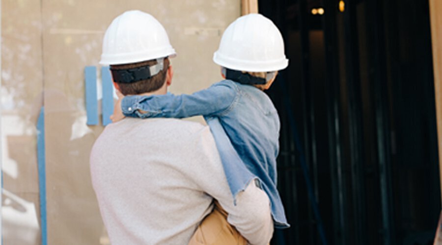 Father and son in construction hats